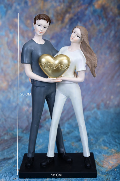 Together in Love – Couple Holding Golden Heart Figurine
